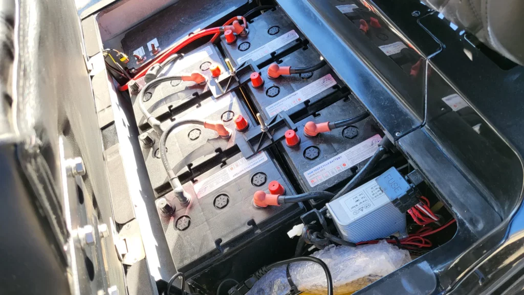 should a leaking golf cart battery be replace