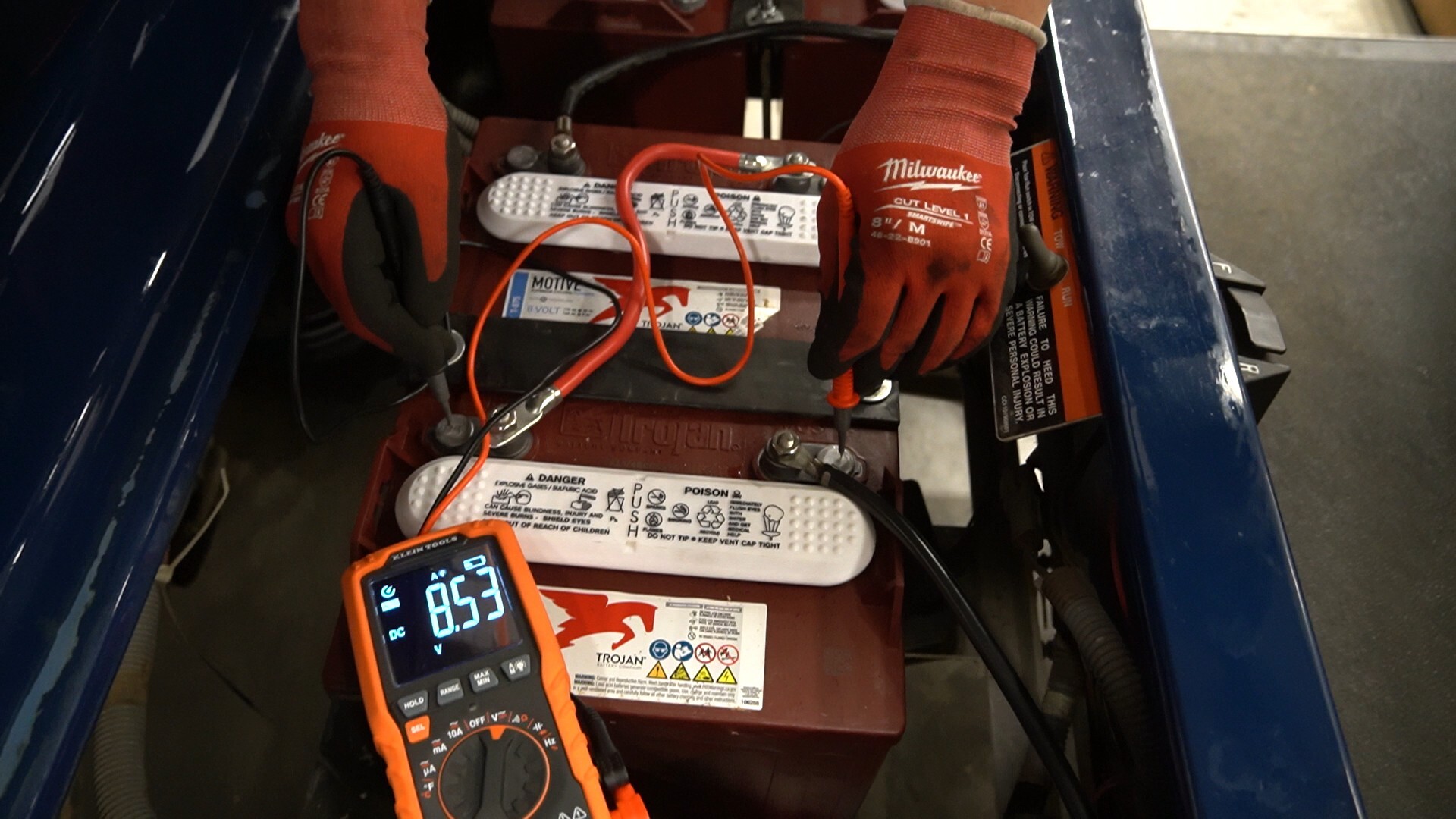 How do you use a 6-volt battery load tester for a golf cart